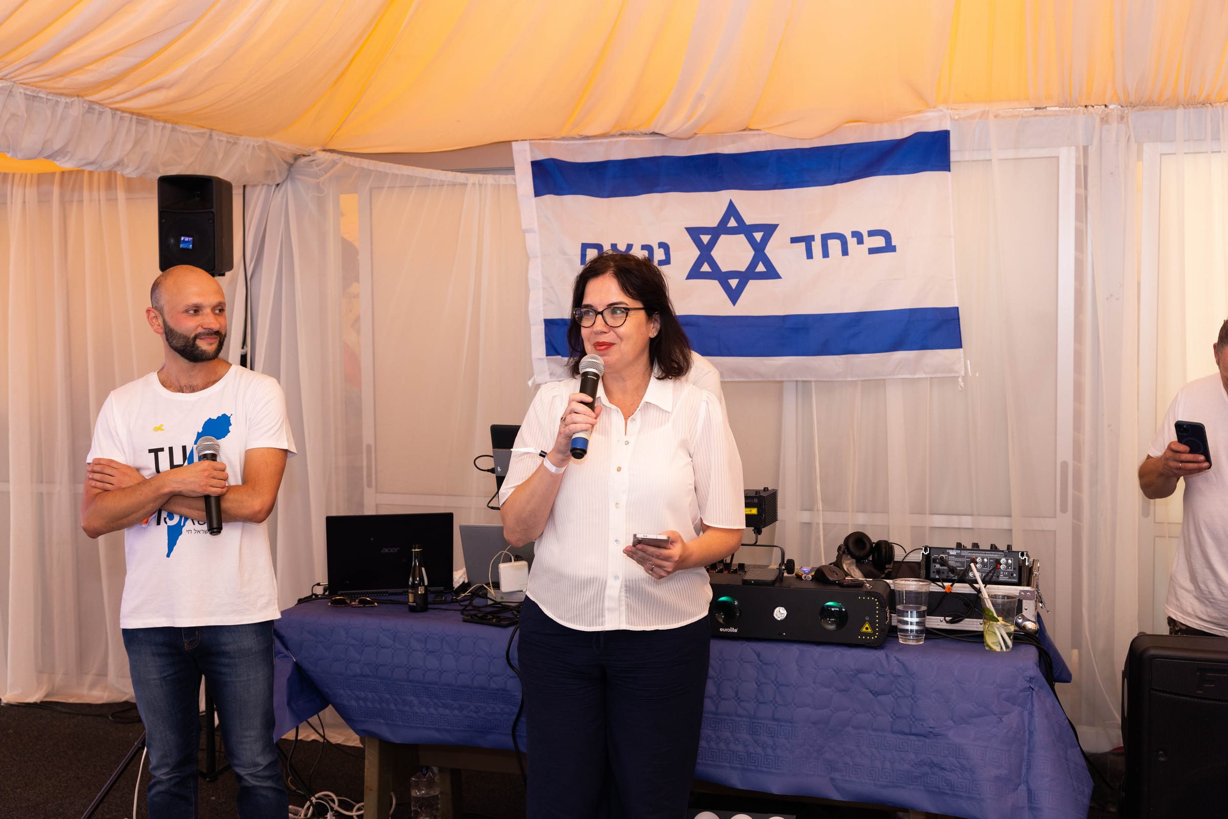Outdoor lecture event with Israeli solidarity banner